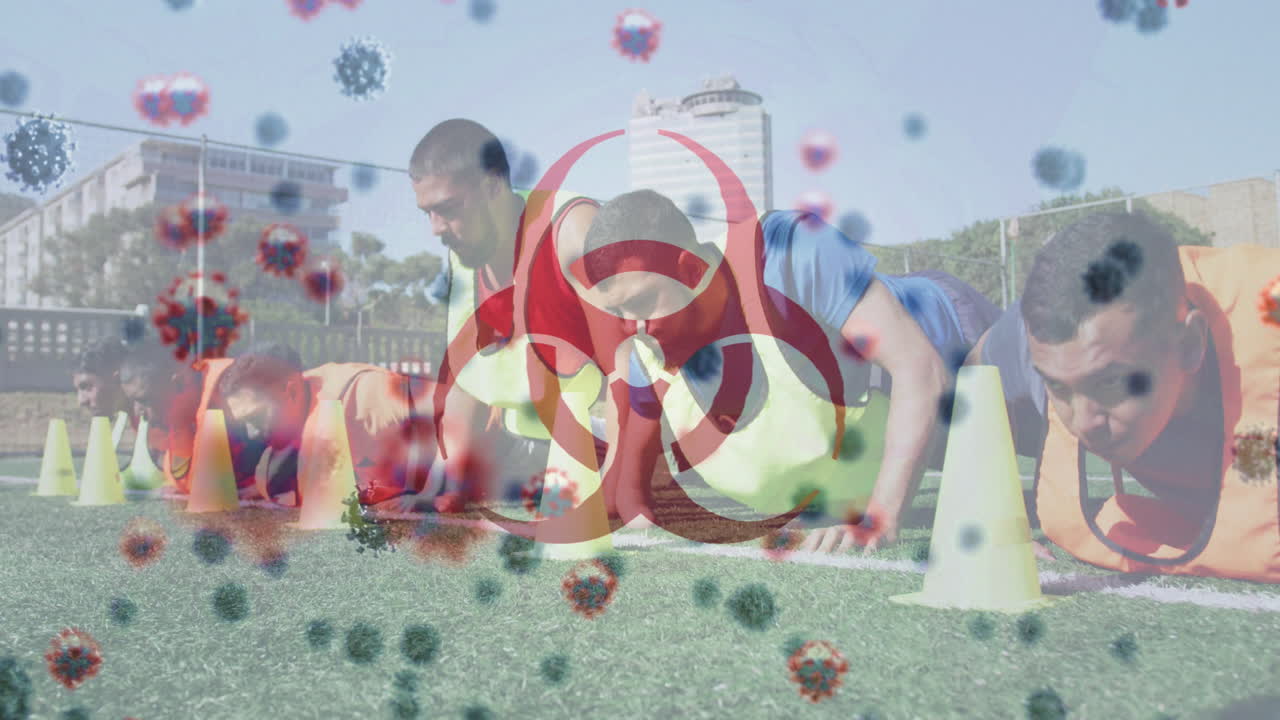 바이오해저드 상징과 코로나19 세포가 크런치 운동을 하는 남자 축구 선수 팀을 상대로