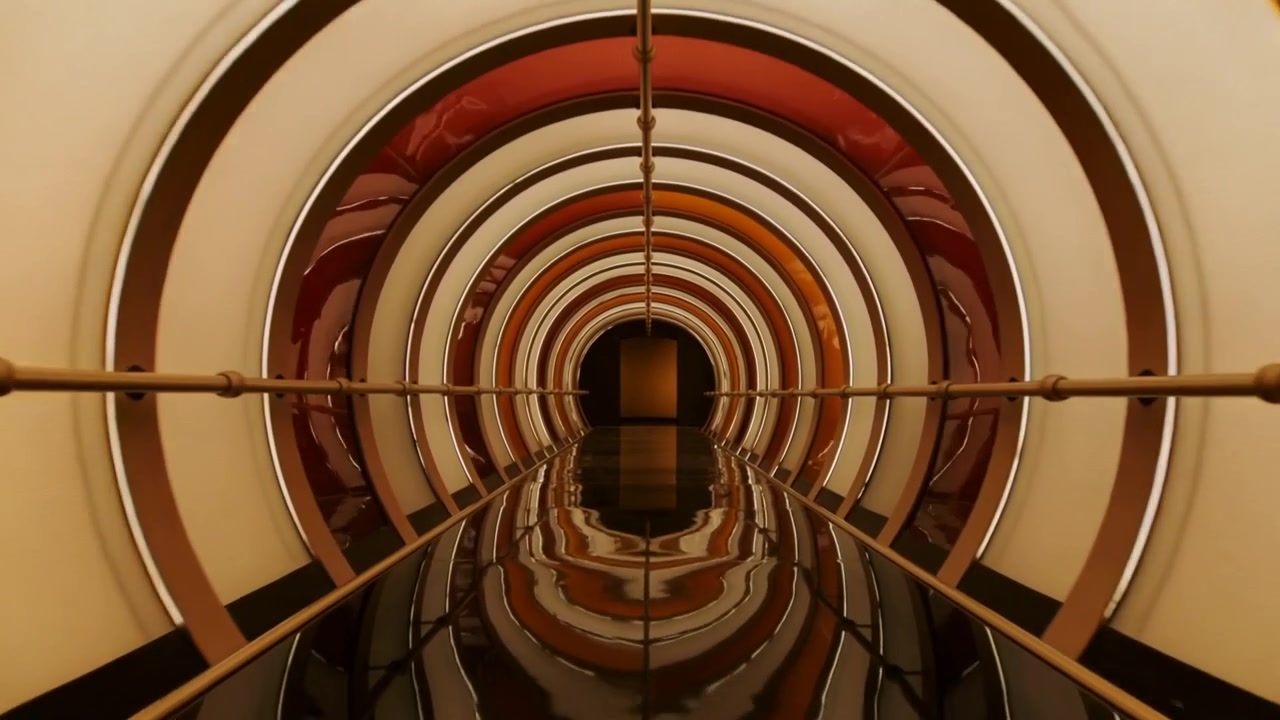 Gliding camera moving after shift through ringed tunnel in exhibit, revealing rod and mirror floor