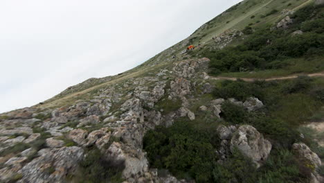 mountainous landscape with people and vehicles