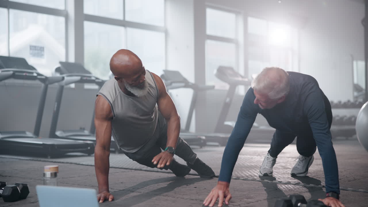 Senior Men Exercising Together in Gym