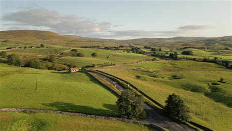 establishing drone shot over hills and fields in yorkshire dales national park