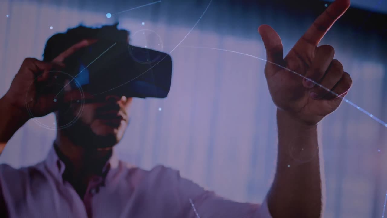 Animation of network of connections over businessman wearing vr headset