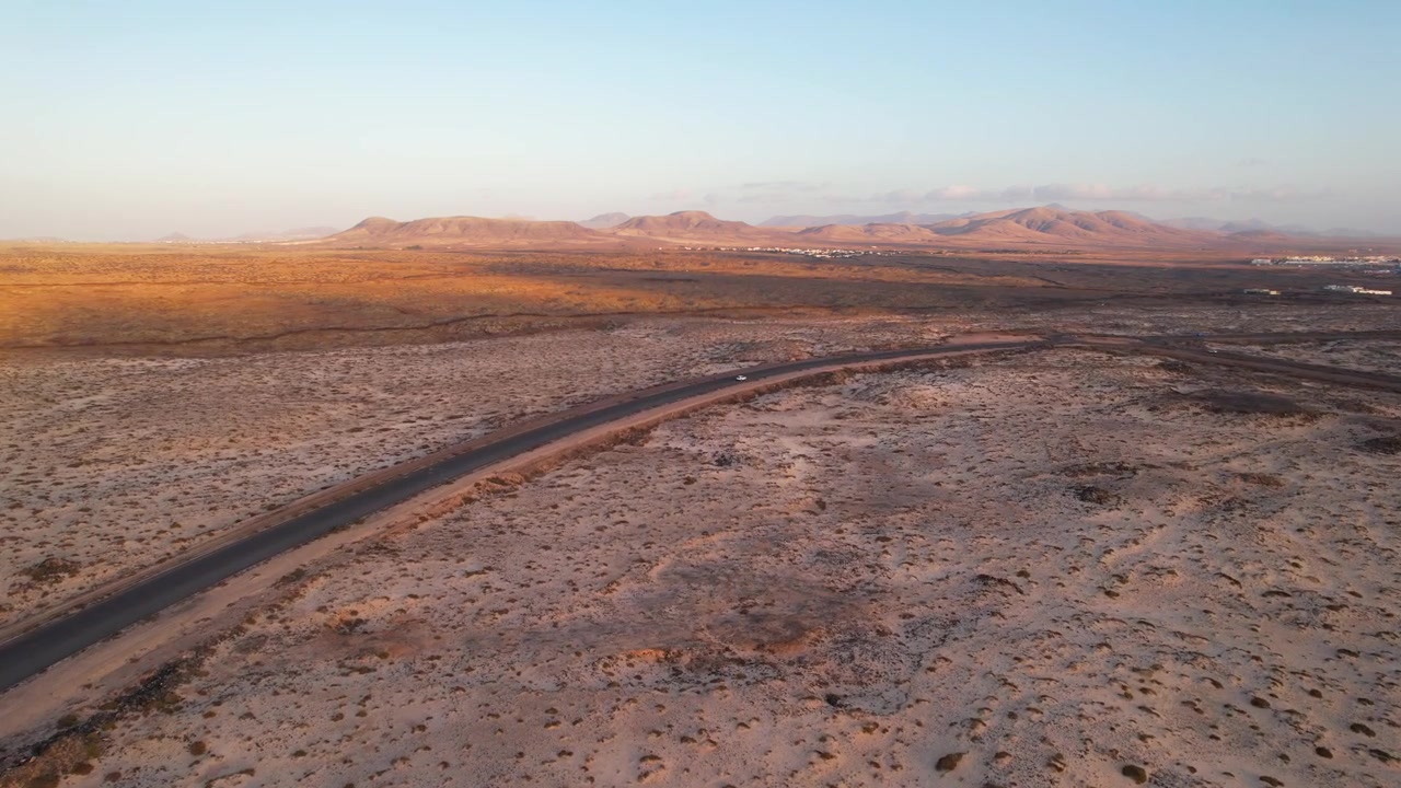 Vehicles driving a remote road of Fuerteventura, Canary Islands. Aerial