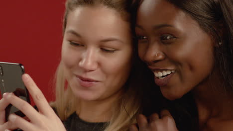 Close-Up-of-Women-Looking-at-Phone