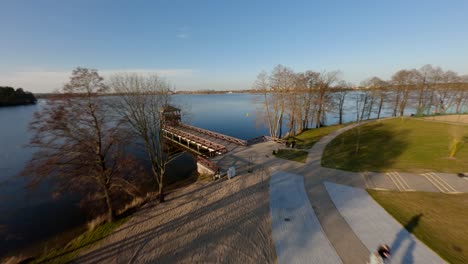 people at plaza miejska beach on shore of elk lake in elk, masuria, poland