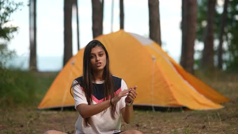 girl camping in the woods