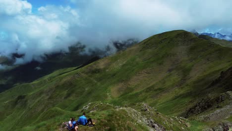 aerial view of people resting on a mountain summit during summer