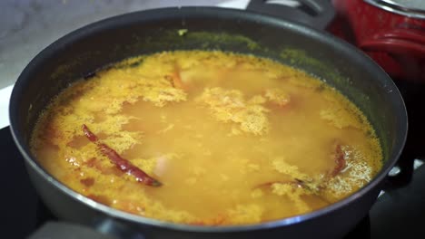 cooking indian dal in a pan