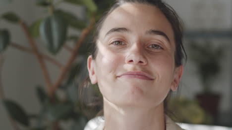 happy woman removing face mask and smiling