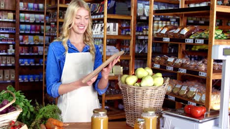 Female-staff-showing-organic-sign-board