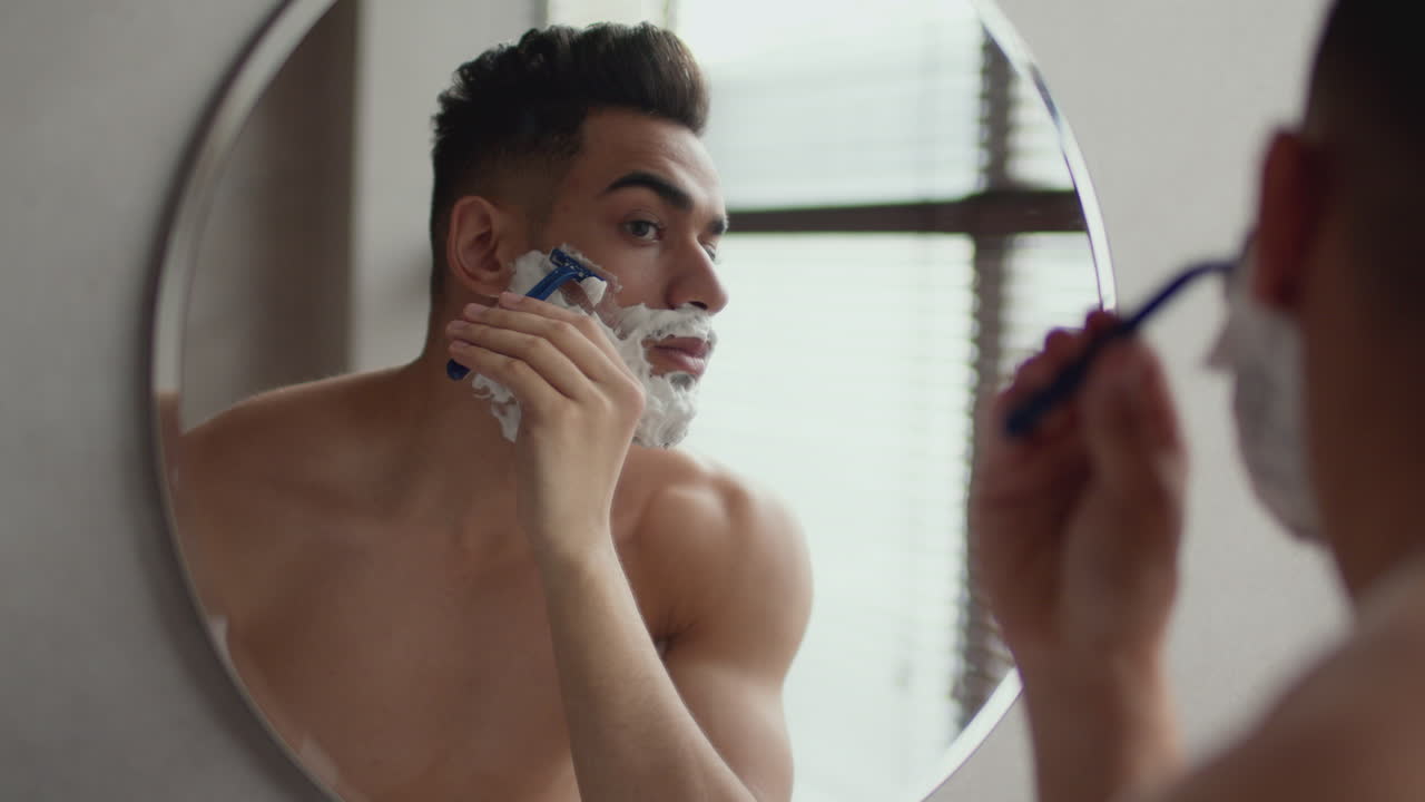 Man Shaving in Bathroom