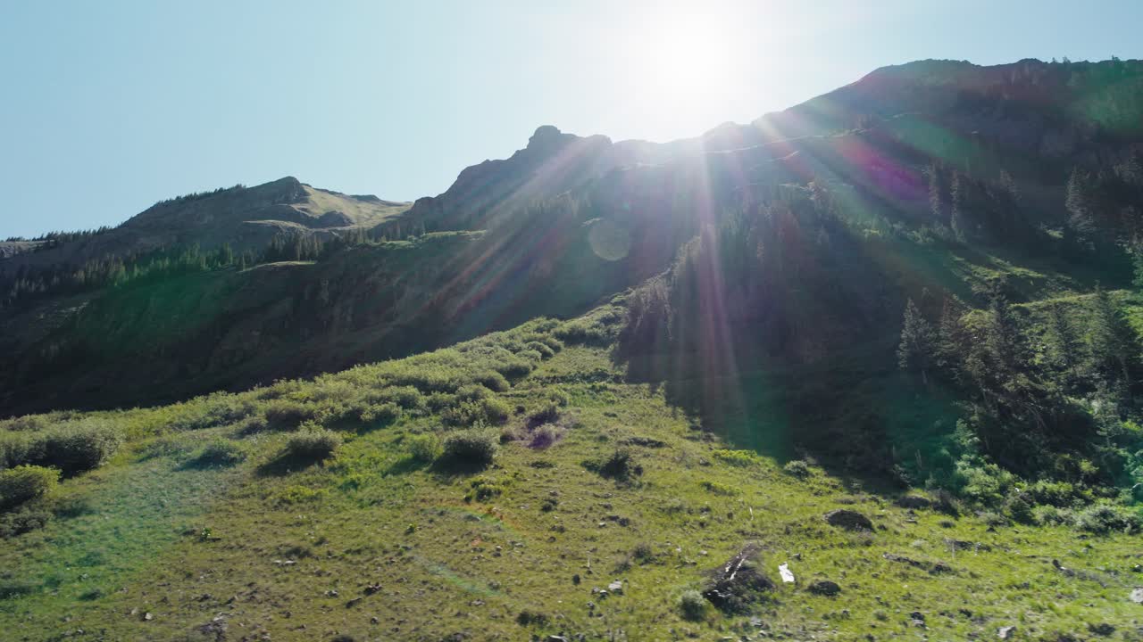 Tracking aerial shot in the valley of the San Juan mountains in Colorado.