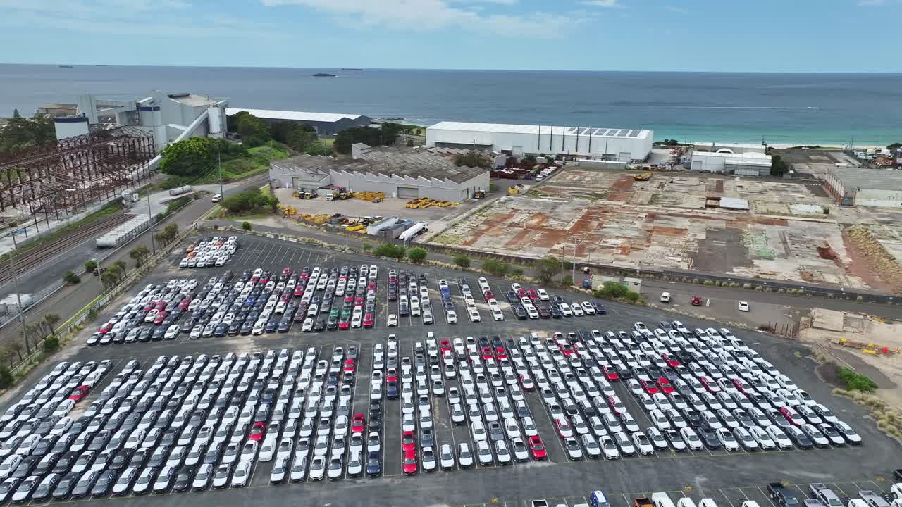 Aerial View of a Massive Car Parking Lot Near the Ocean