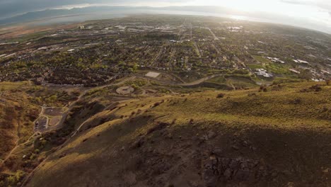 From-the-summit-towards-Provo,-the-breathtaking-panorama-of-the-majestic-wasatch-mountains-stretches-out-before-you,-revealing-an-awe-inspiring-vista-of-natural-beauty,-Utah-valley