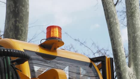 yellow construction vehicle with warning light