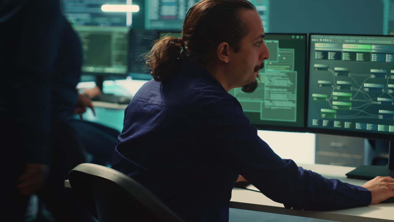 Cyber security experts in governmental hacking room working on securing networks