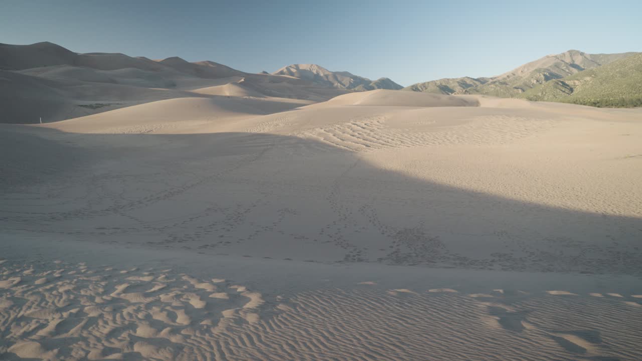 Sand Dunes and Mountain Landscape