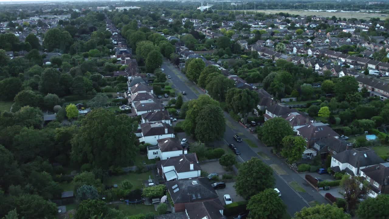 Evening Aerial Drone Footage Over Residential Homes in Sunbury, Surrey. Car Driving Down Street