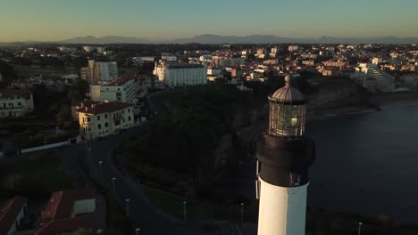 biarritz lighthouse at sunset with cityscape and panoramic view on coast, france