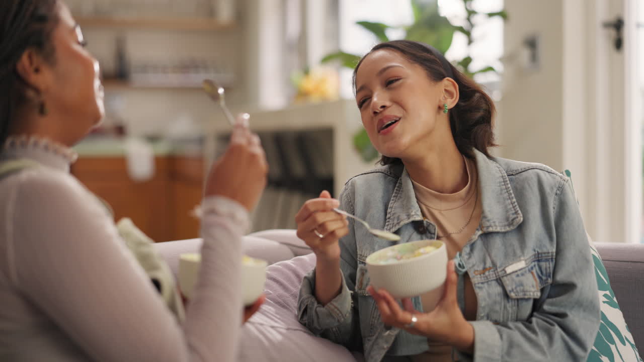 Two friends enjoying a meal together at home