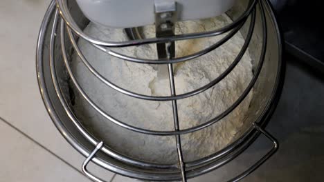 pierogi dough being prepared in a mixer