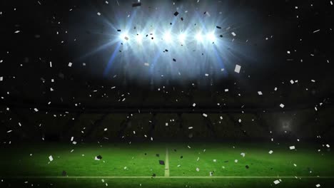 Animation-of-confetti-falling-over-floodlit-pitch-at-sports-stadium-at-night