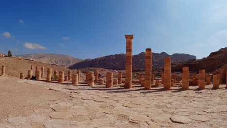 wide angle push in to remnant spire columns of old ancient structure in rose city petra