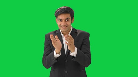 Happy-Indian-manager-clapping-and-motivating-employees-Green-screen