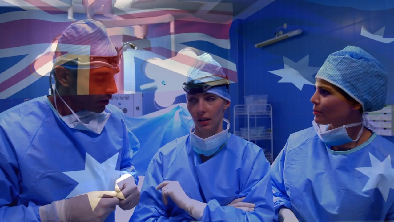 Medicinsk team diskuterer operation på en hospitalsoperationsstue.