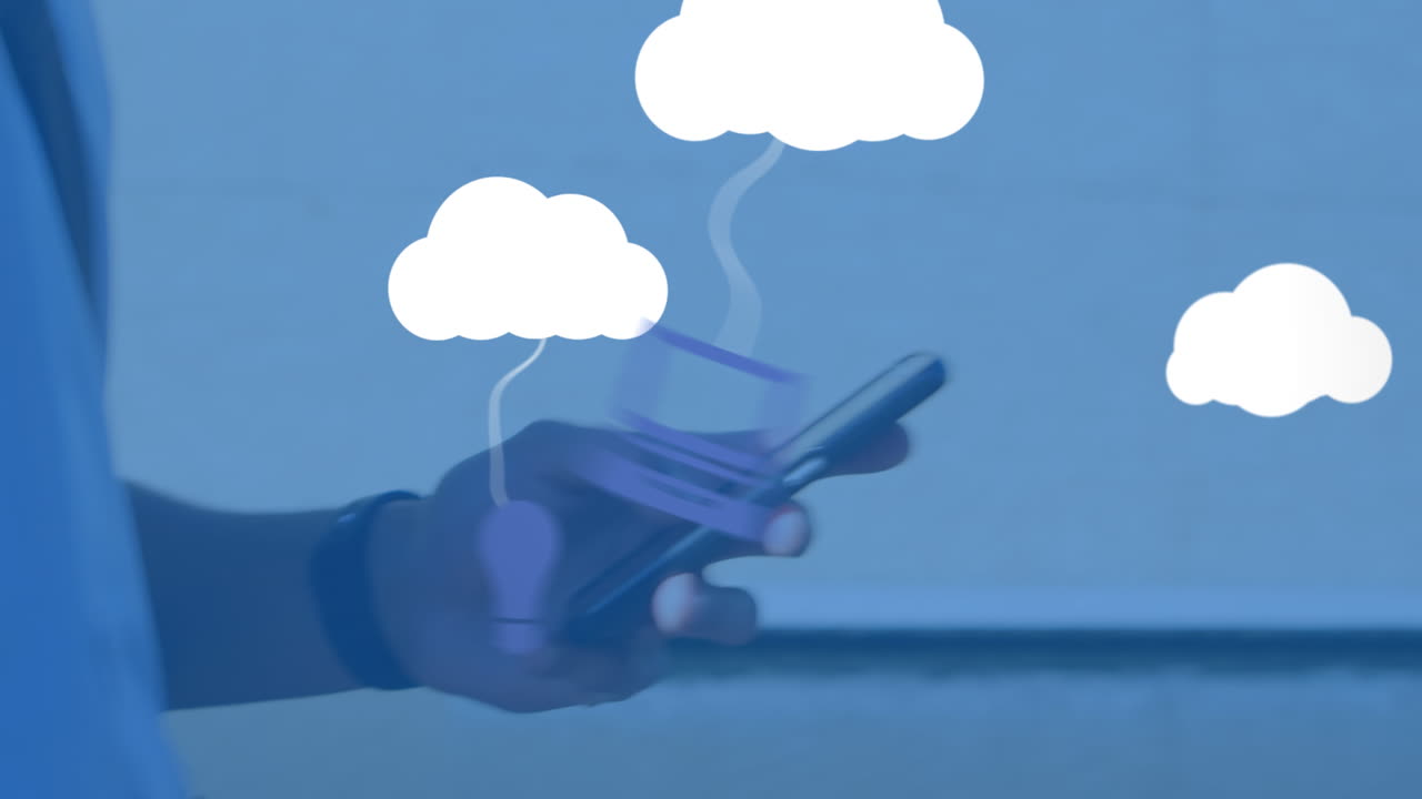Animation of clouds with electronic devices over caucasian man using smartphone