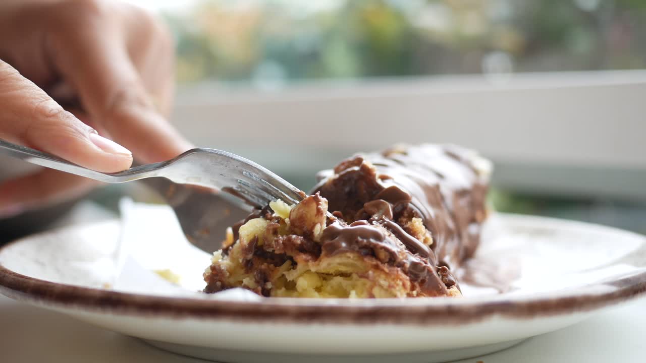 Cutting into a Chocolate Roll Cake
