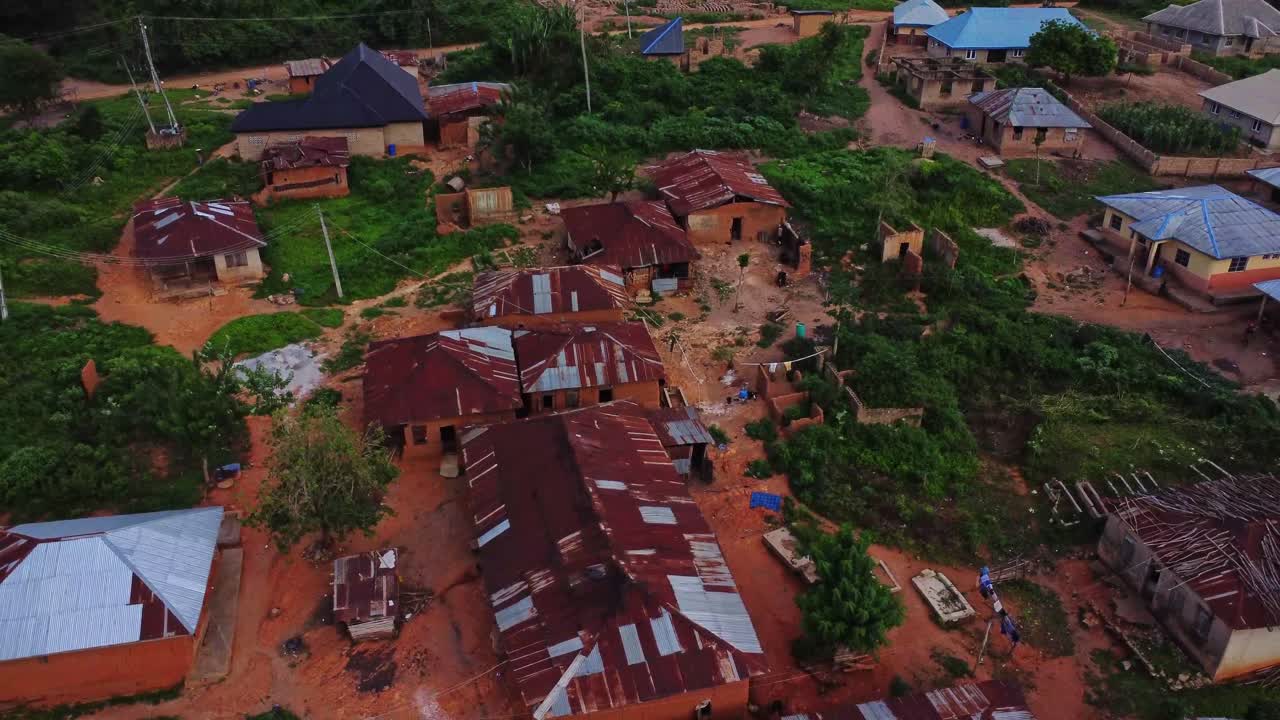 Beautiful wide aerial view of a small village with old and new houses in the countryside of Nigeria, Africa
