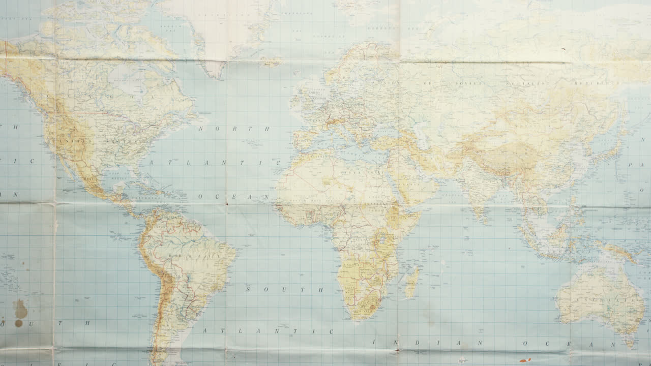 Top view hands pointing at vintage world map  connecting global markets at desk from above - Red Epic Dragon