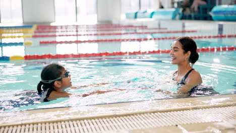 woman and child swimming in a pool