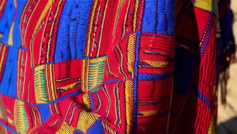 women weaving traditional african clothing