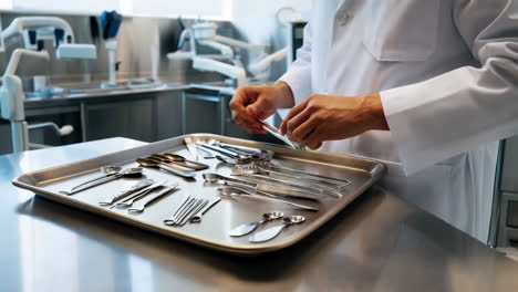 medical professional handling a tray of instruments
