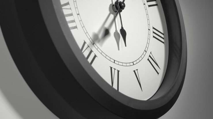 Latin Clock Face in Time Lapse on White Wall