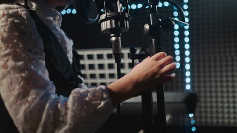 young girl singing in a recording studio