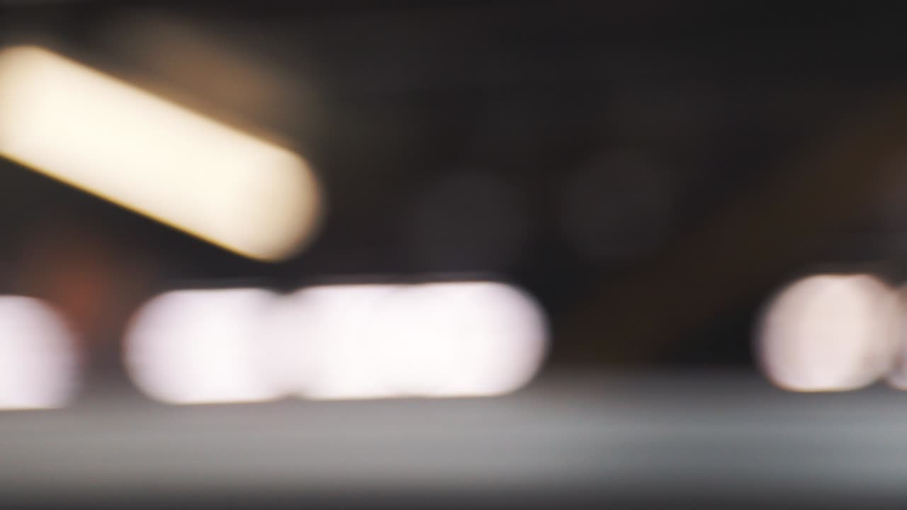 Beautiful detail of blurred moving lights. Blurred commuters waiting for train on subway