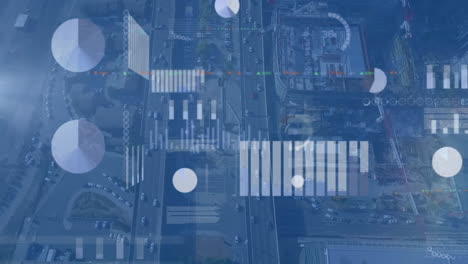 animation of screens with statistical data processing against aerial view of cityscape
