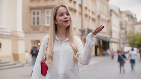 thoughtful woman pointing empty place advertising area for commercial text copyspace in city street
