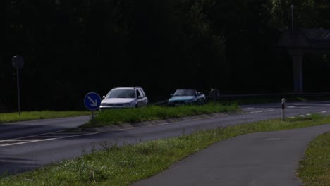 the exterior wall of an old house in goldbach, germany, near a bicycle path and a busy road with car traffic. a blend of historic architecture, modern transportation, and daily urban life.