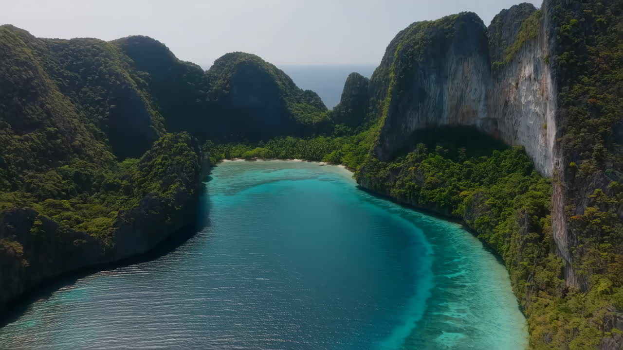 Aerial View of a Stunning Tropical Bay with Limestone Cliffs and Clear Turquoise Water