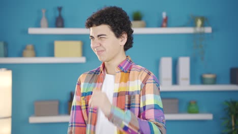boy looking at camera with disgust.