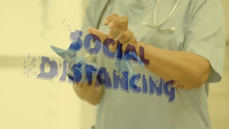 social distancing text against mid section of surgeon wearing surgical gloves