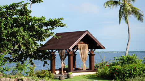 outdoor luxurious spa treatment gazebo or pavilion for two persons by the sea in tropical nature in bali