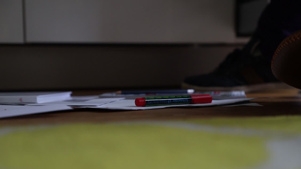 Crime Scene Unit officer numbering evidence in an apartment.