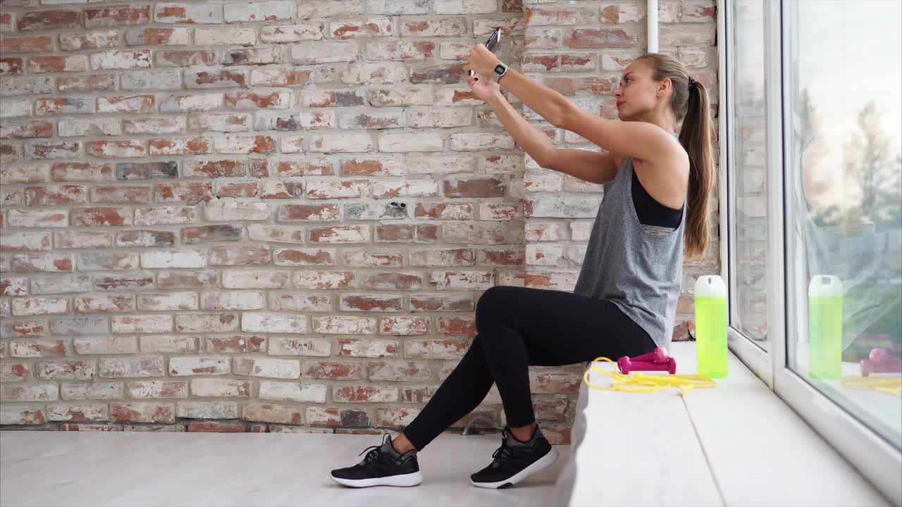 Woman taking a selfie after workout