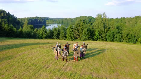 Aerial-view-of-several-medieval-warriors-in-armor-in-circle-formation-preparing-for-battle