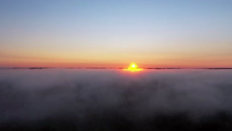 sunrise with sun running along the clouds.